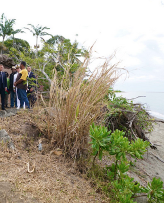 PNG plans 21-gun salute for Macron in historic visit to an independent Pacific state French President Emmanuel Macron visits Kanak villagers yesterday in an area near Tuoho