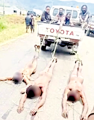 Bodies of three of the shot gunmen being dragged out on the road
