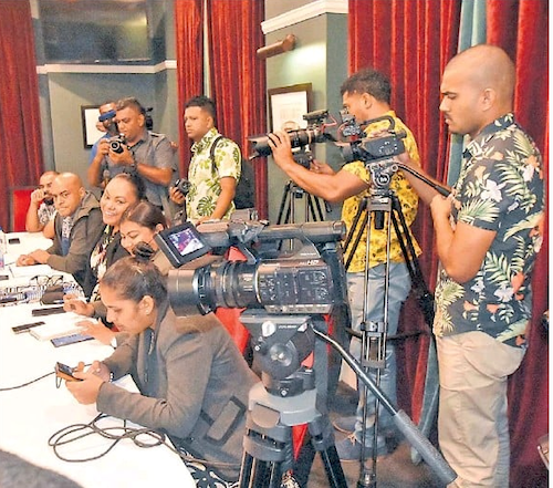 Journalists and camera people at a Suva media conference