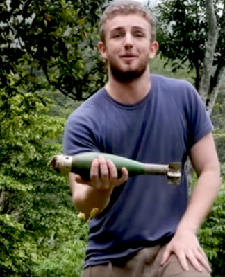 Filmmaker Kristo Langker nervously introduces his documentary with one of the Indonesian attack bombs that failed to explode