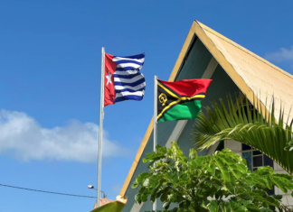 Flying high . . . the Morning Star ensign -- banned in Indonesia -- flying alongside the Vanuatu national flag in Port Vila