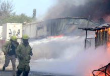 Firefighters battle to put out a Port Moresby fire