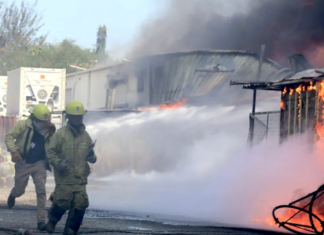 Firefighters battle to put out a Port Moresby fire
