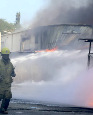 Firefighters battle to put out a Port Moresby fire