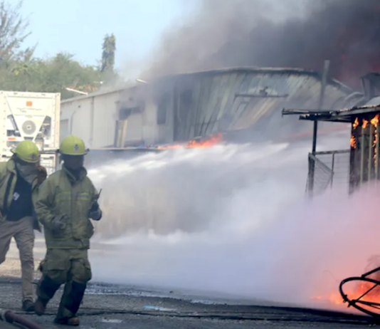 Firefighters battle to put out a Port Moresby fire
