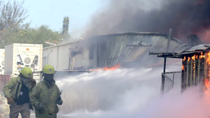Firefighters battle to put out a Port Moresby fire