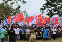 The West Papua delegation flying the Morning Star flag at the opening of the MACFEST 2023