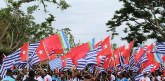 The West Papua delegation flying the Morning Star flag at the opening of the MACFEST 2023