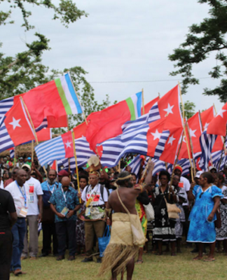 The West Papua delegation flying the Morning Star flag at the opening of the MACFEST 2023