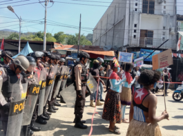 Women protesters daubed in the colours of the Morning Star flag of West Papuan independence