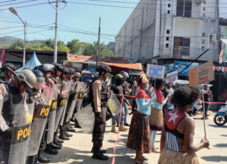 Women protesters daubed in the colours of the Morning Star flag of West Papuan independence