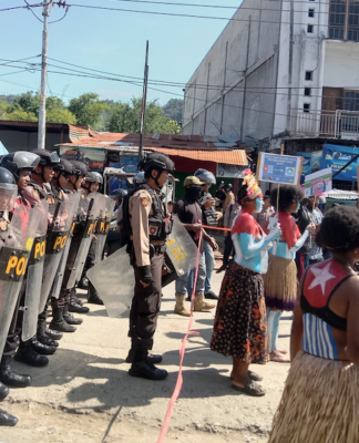 Women protesters daubed in the colours of the Morning Star flag of West Papuan independence