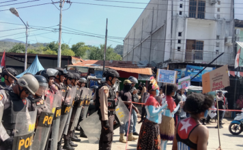 Women protesters daubed in the colours of the Morning Star flag of West Papuan independence