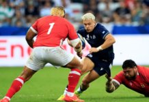 Scotland's wing Darcy Graham is tackled by Tonga's tighthead prop Ben Tameifuna during the Rugby World Cup