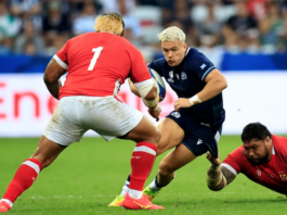 Scotland's wing Darcy Graham is tackled by Tonga's tighthead prop Ben Tameifuna during the Rugby World Cup