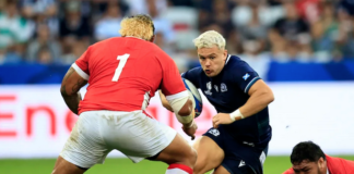 Scotland's wing Darcy Graham is tackled by Tonga's tighthead prop Ben Tameifuna during the Rugby World Cup