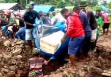 The five killed Papuan youths being buried at Kilo Enam Public Cemetery