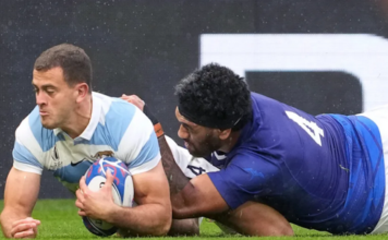 Argentina's wing Emiliano Boffelli (left) scores a try in WRC2023