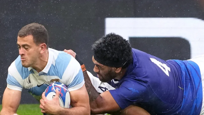 Argentina's wing Emiliano Boffelli (left) scores a try in WRC2023