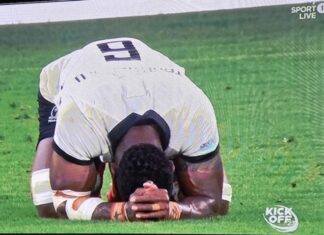 Prayers of elation . . . a jubilant Fiji after beating Australia 22-15