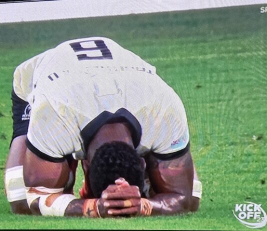 Prayers of elation . . . a jubilant Fiji after beating Australia 22-15