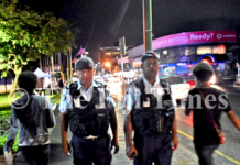 Fiji police officers Corporal Gerry McGoon (on left) and PC Sevania Manulevu on foot patrol along Victoria Parade in Suva