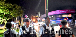 Fiji police officers Corporal Gerry McGoon (on left) and PC Sevania Manulevu on foot patrol along Victoria Parade in Suva