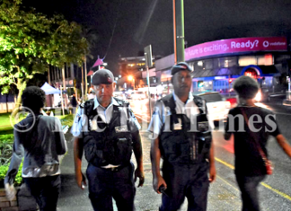 Fiji police officers Corporal Gerry McGoon (on left) and PC Sevania Manulevu on foot patrol along Victoria Parade in Suva