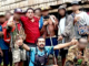 The controversial photo of Milne Bay Governor Gordon Wesley (red shirt) and gang leader Eugene Pakailasi (blue shirt)