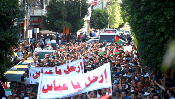 Palestinian demonstrators protesting in Ramallah in the Occupied West Bank against Palestine President Mahmoud Abbas in the aftermath of the death of activist Nizar Banat