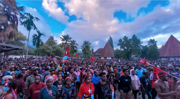 West Papuan Morning Star flags flying to wecome Victor Yeimo