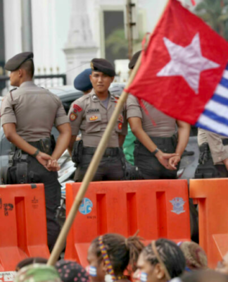 Indonesian security forces confront a West Papuan demonstration