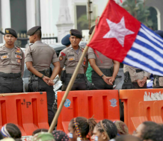 Indonesian security forces confront a West Papuan demonstration