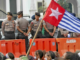 Indonesian security forces confront a West Papuan demonstration