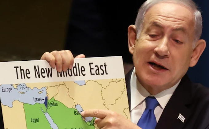 Israeli Prime Minister Benjamin Netanyahu holds a map of the "New Middle East" without Palestine 