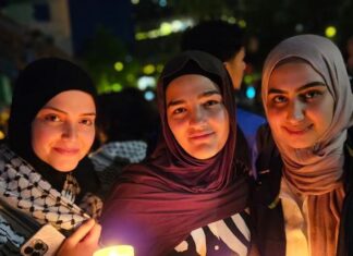 Palestinians and community supporters mourn the deaths in the Gaza hospital bombing