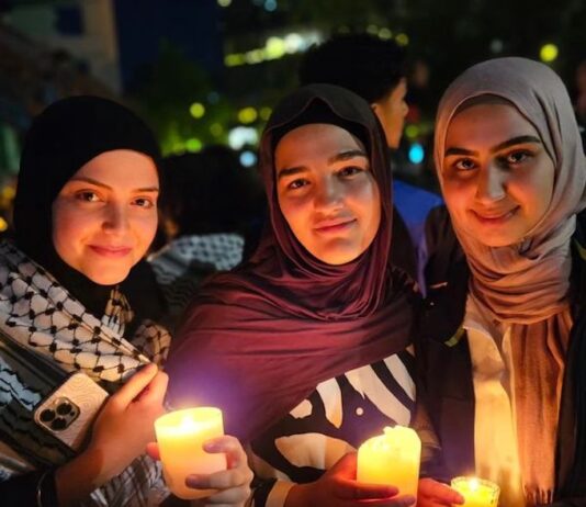 Palestinians and community supporters mourn the deaths in the Gaza hospital bombing