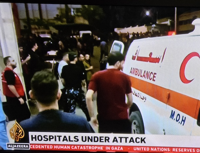 A Gaza ambulance . . . a besieged city and its hospitals overwhelmed by the continuous Israeli bombing