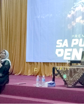 Latifah Anum Siregar, director of the Alliance for Democracy for Papua (right), speaks