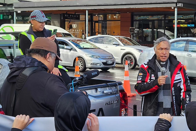 Reverend Mua Strickson-Pua offering a prayer