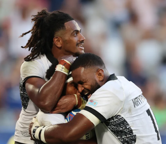 Vinaya Habosi of Fiji celebrates scoring