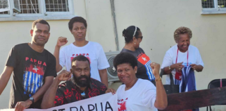 Piango Pacific activists in Fiji prepare their Morning Star flags