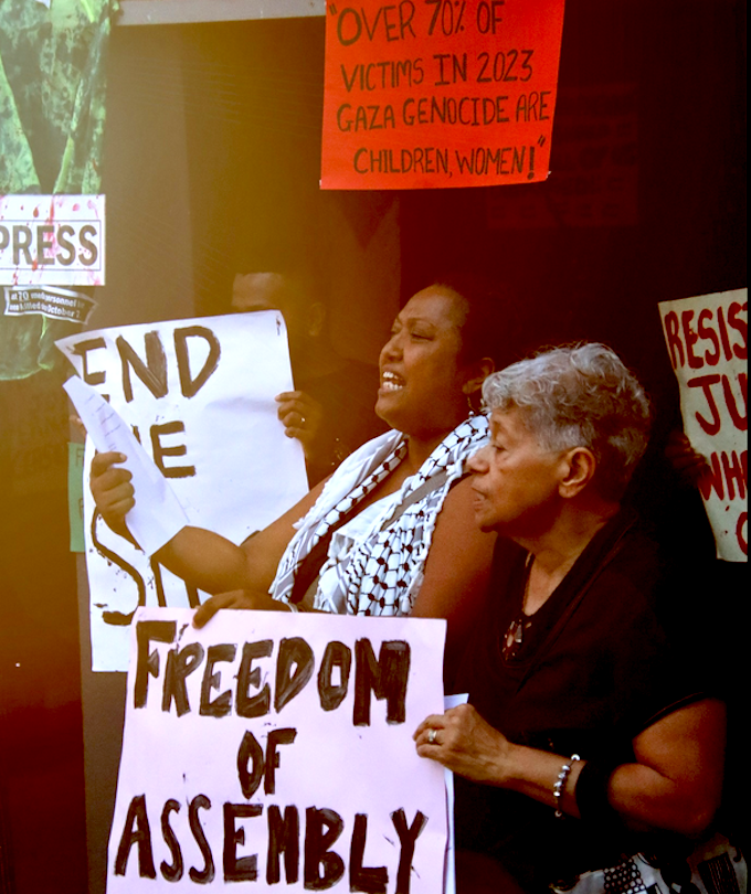 Participants at the Fiji vigil in tribute to the Palestinian journalists