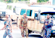 PNG riot police and Defence Force officers on duty