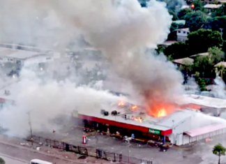 Rioters set fire to this store in Port Moresby
