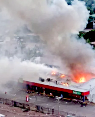 Rioters set fire to this store in Port Moresby