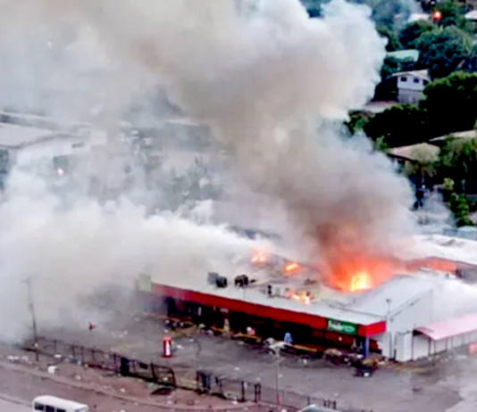 Rioters set fire to this store in Port Moresby