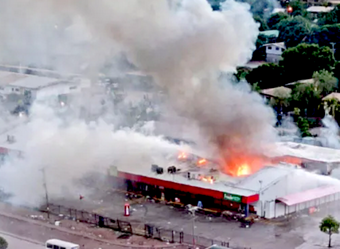 Rioters set fire to this store in Port Moresby