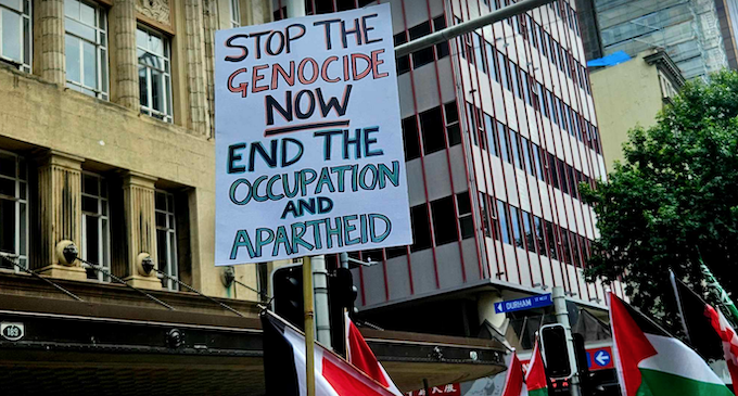 "Stop the genocide now" placard