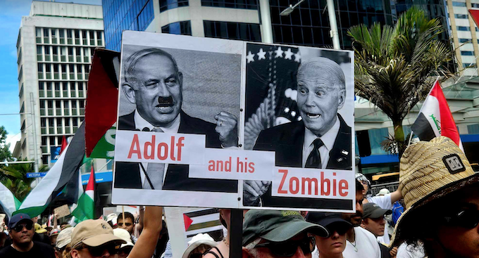 "Adolf and his zombie" poster at the rally in Auckland yesterday